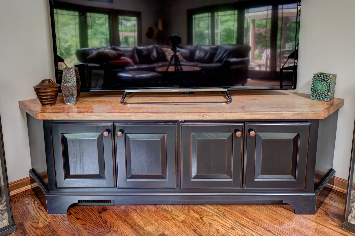 Espresso media console with a live-edge maple top