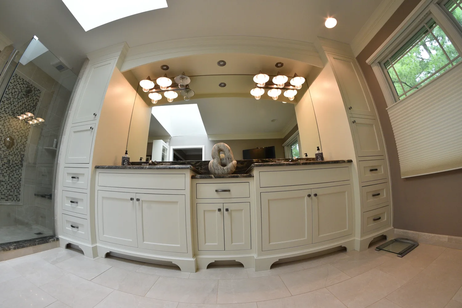 Master bathroom vanity with arched detail and dual mirrors